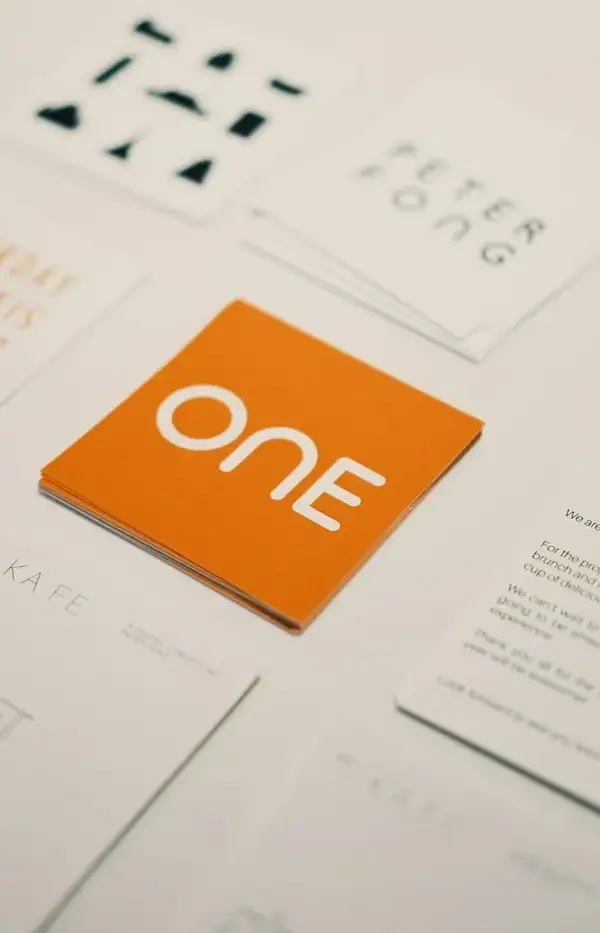 Brand identity cards laid out on a table