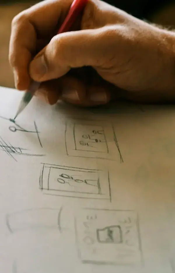 Sketching ideas in a spiral notebook