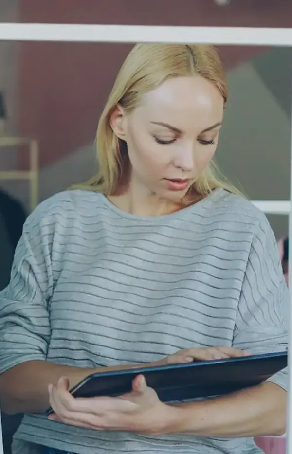 Store owner checking stock on a tablet