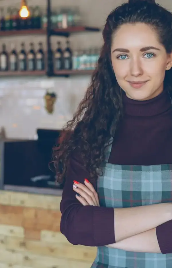 Business owner standing in her shop