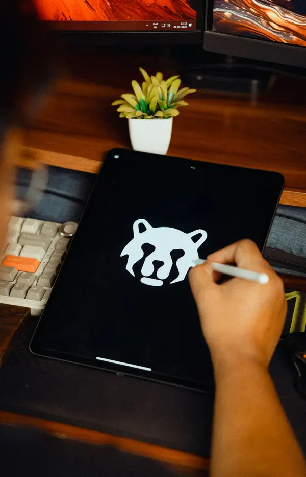 Designer drawing a logo on a tablet