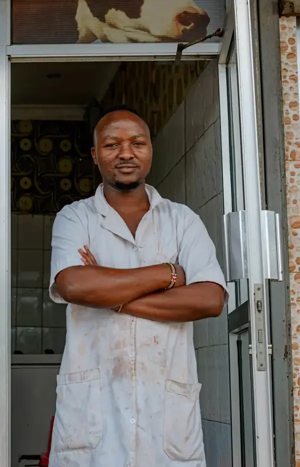 Shop owner standing in his doorway